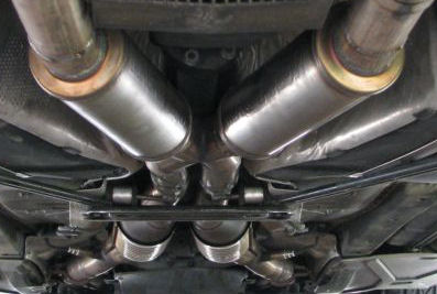 Twin mufflers fitted under a car
